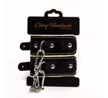 Черные скругленные наручники с мягкой бежевой подкладкой