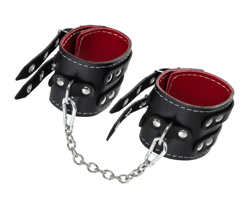 Черные кожаные оковы с двумя ремнями и красной подкладкой