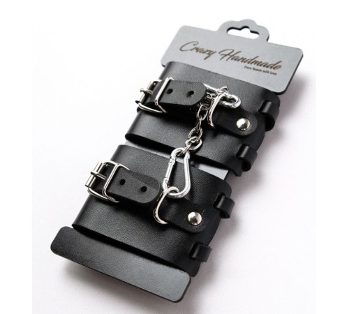 Черные кожаные наручники с ремешками